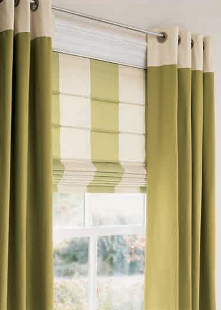 Green and white striped Roman blinds crafted from elegant fabric, paired perfectly with matching green curtains hanging on a rod above the window, bring a cohesive burst of colour to any room.