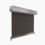 Outdoor Wired Guide Blinds feature a dark fabric panel in a metallic rectangular housing, mounted on two vertical guide wires for motorized operation.