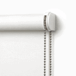 A close-up of a Sanctuary Internal Roller Blind in white, featuring a silver beaded chain mechanism on the right side, mounted against a white wall.
