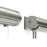 Close-up view of two silver cylindrical wall-mounted curtain rods with simple, modern end caps and a visible pull cord on the left side.