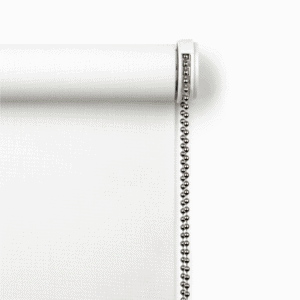 Close-up of a white roller window shade with a silver metal bead chain on the right side against a white background.