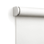 Close-up view of a white roller window shade installed on a wall, showing the top mounting bracket and rolled fabric.