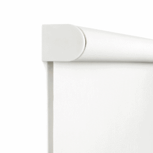 Close-up of a white roller window blind with a rounded top casing, shown partially unrolled against a plain white background.