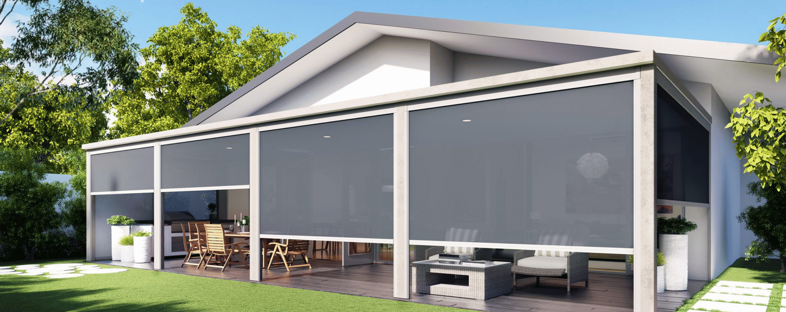 A modern house with a covered patio featuring outdoor furniture and retractable mesh screens, surrounded by a green lawn and trees.